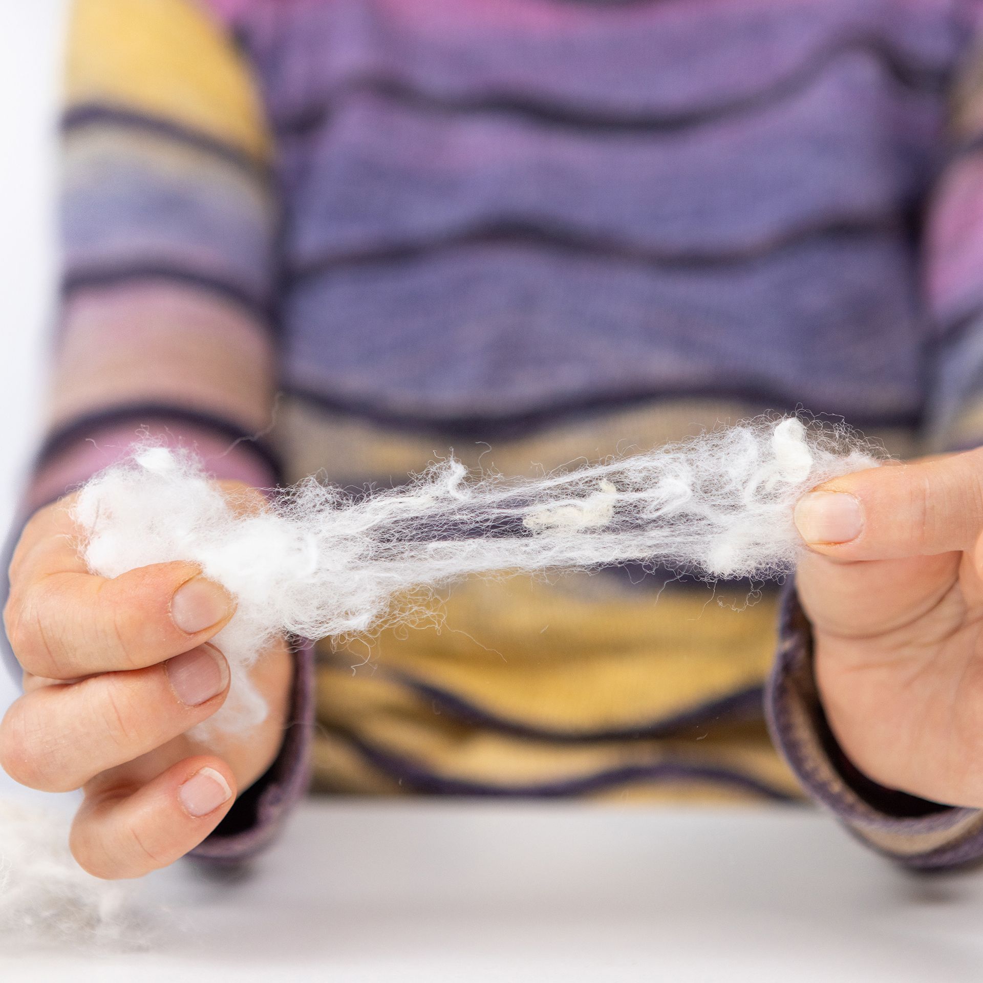 Fadenspinner Flockenwolle vom Schaf im Baumwollbeutel